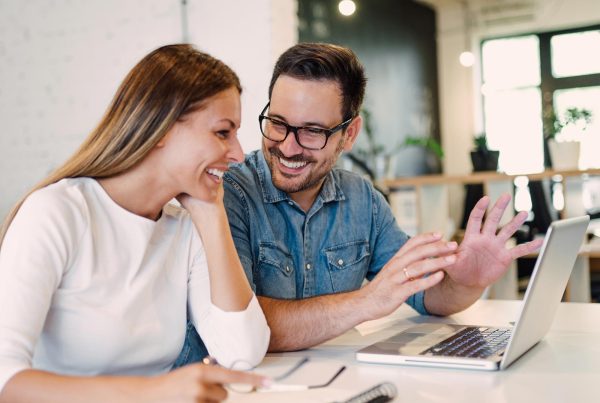 A productive partnership between a business owner and a NZ web designer, discussing a project plan.